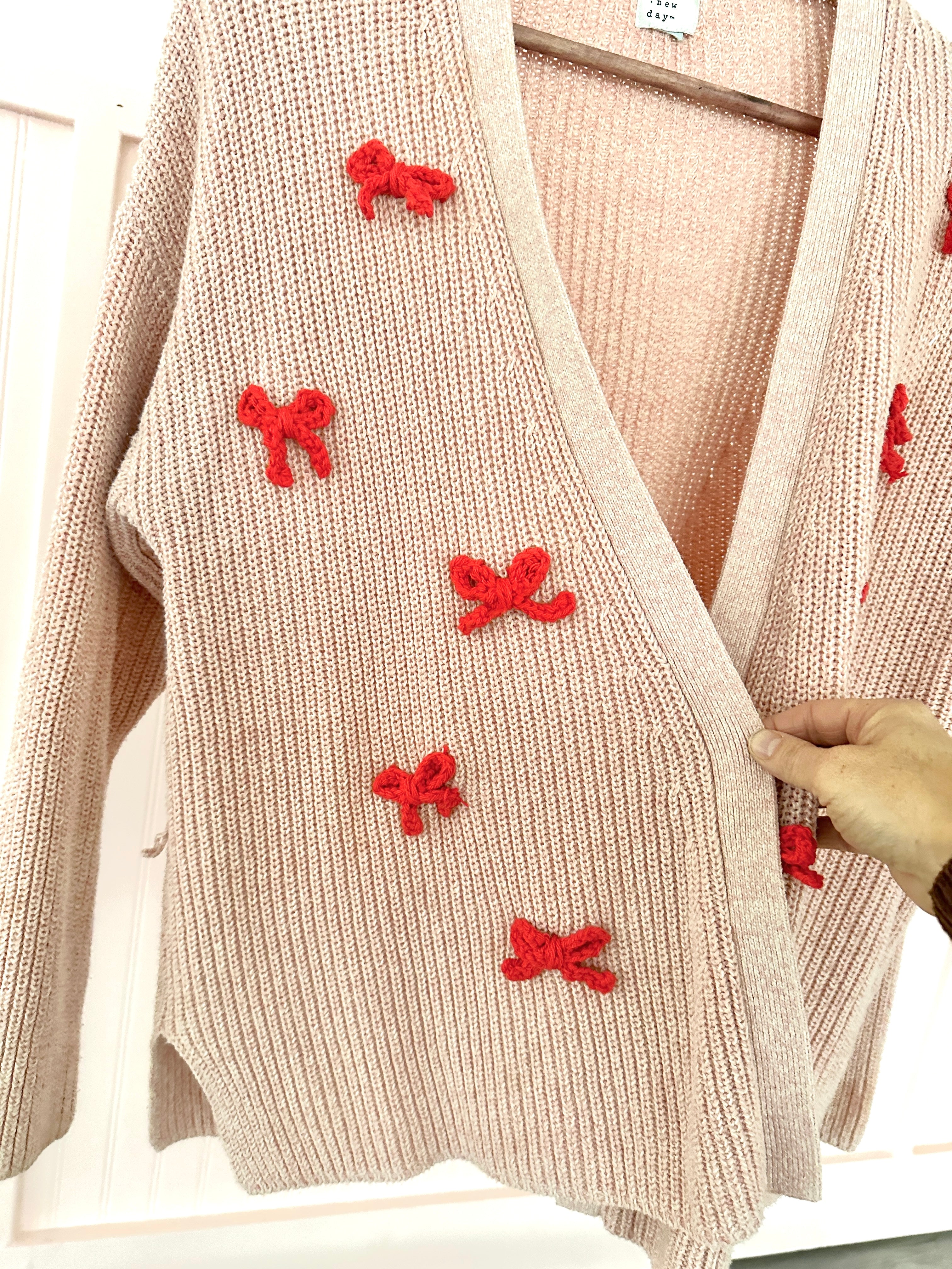 DIY Upcycled Sweater with Crochet Bow Accents. Perfect for Valentine's Day
