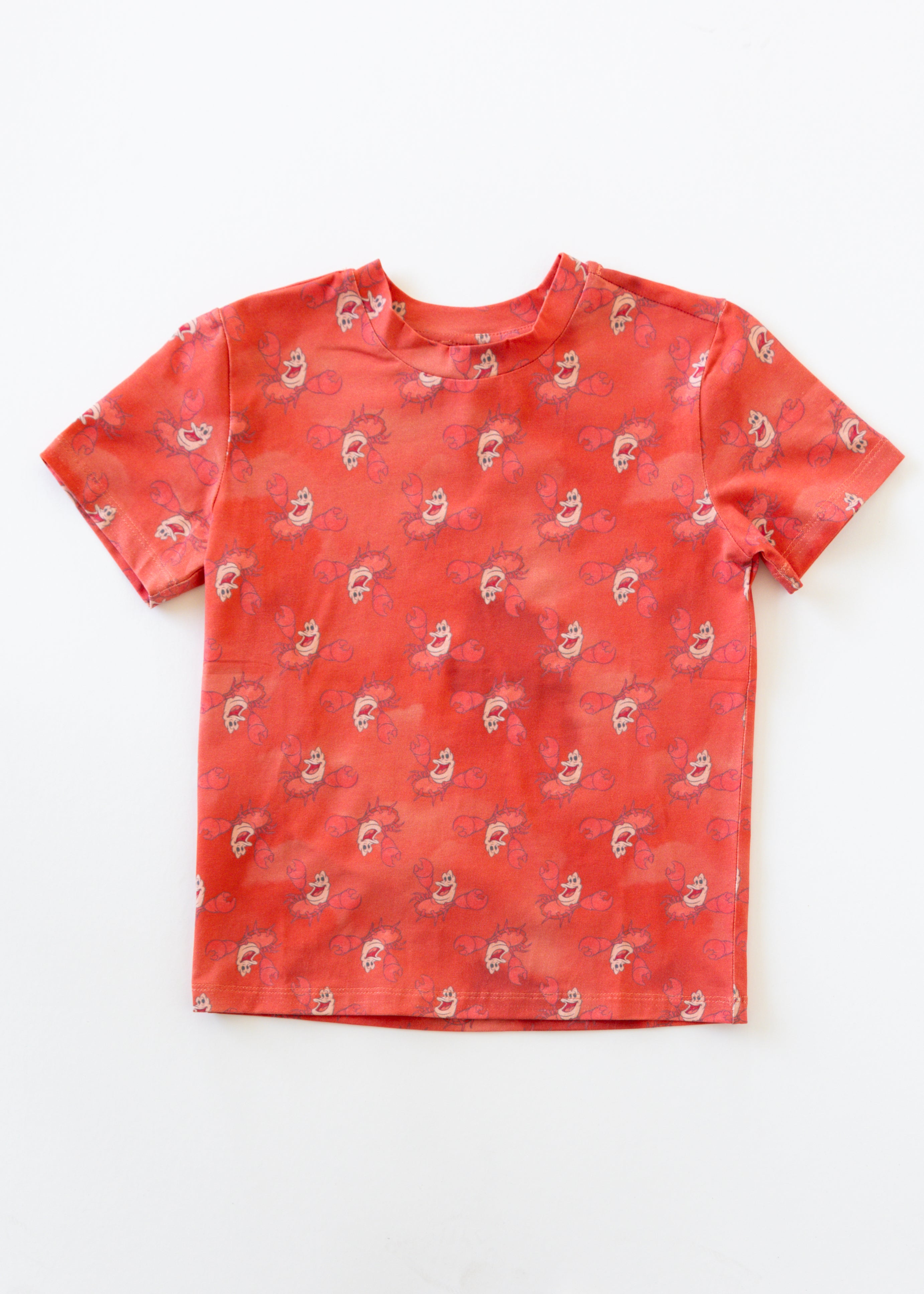 Disney and Taylor Joelle branded Sebastian shirt print all around the kids tee.