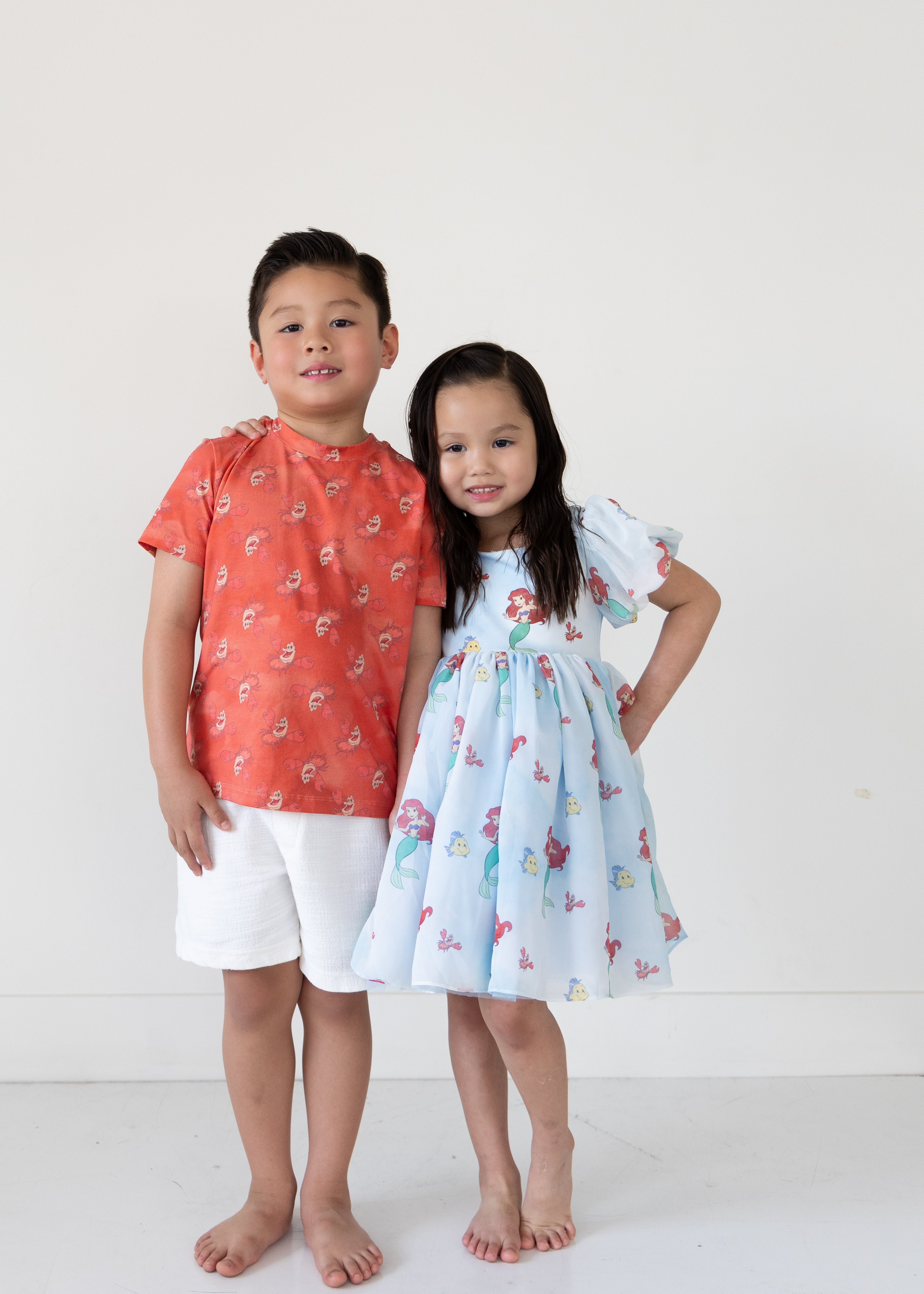 Disney and Taylor Joelle branded Sebastian shirt print all around the kids tee shown with it's partner Ariel dress