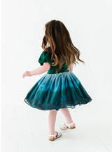 This dress is extra fun to twirl in, and show off the forest scene on the skirt!