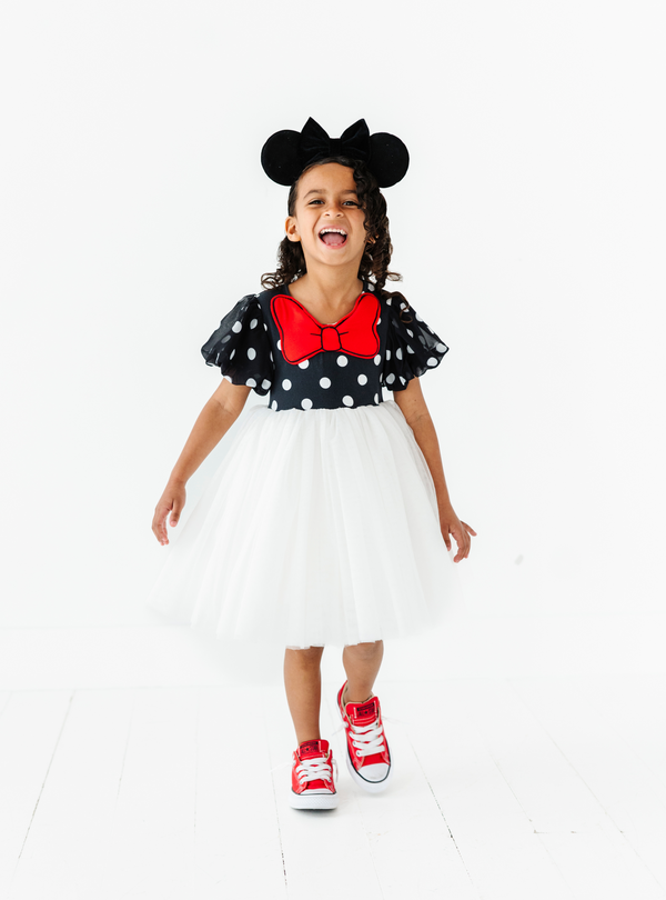 The Black and White Polka Dot Dress - Luxe is a Minnie-inspired dress, with a fun spin on a loveable classic.