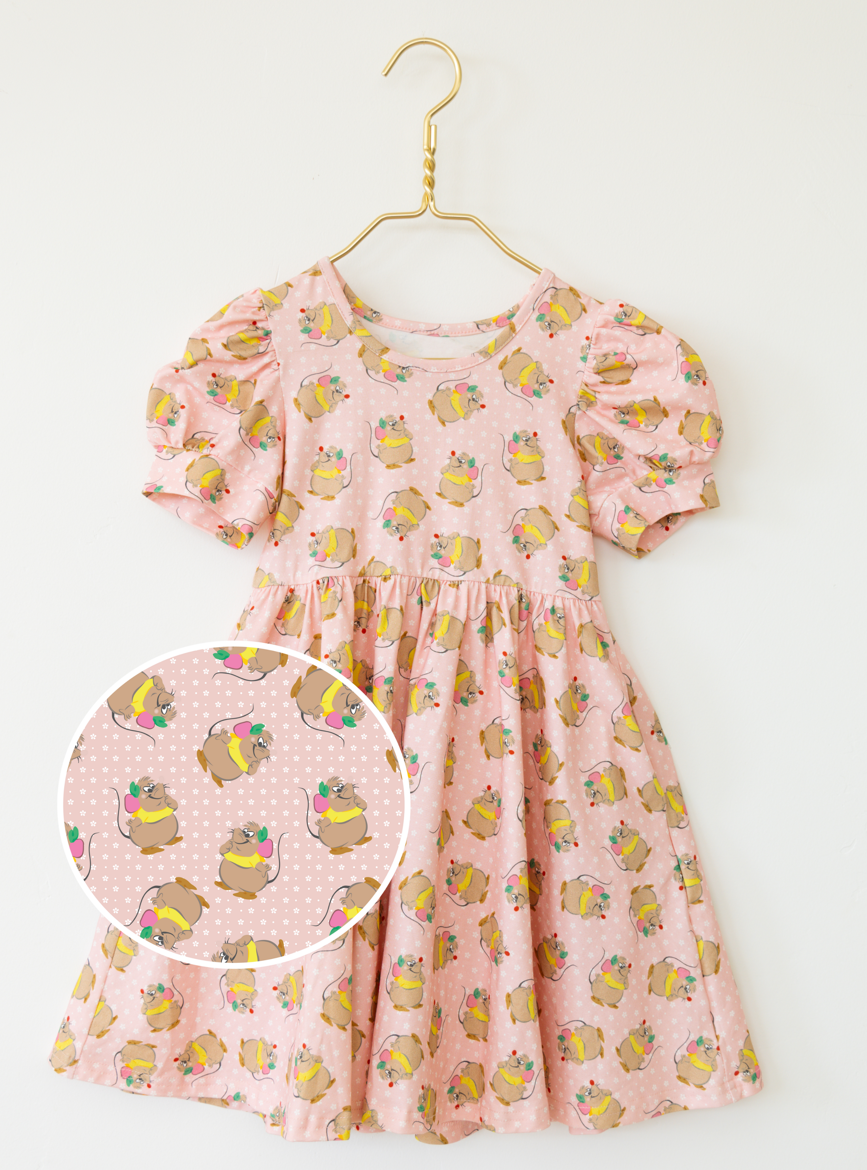 Disney and Taylor Joelle branded Gus Gus Dress with Gus Gus printed all around. This dress is detailed with puff sleeves.