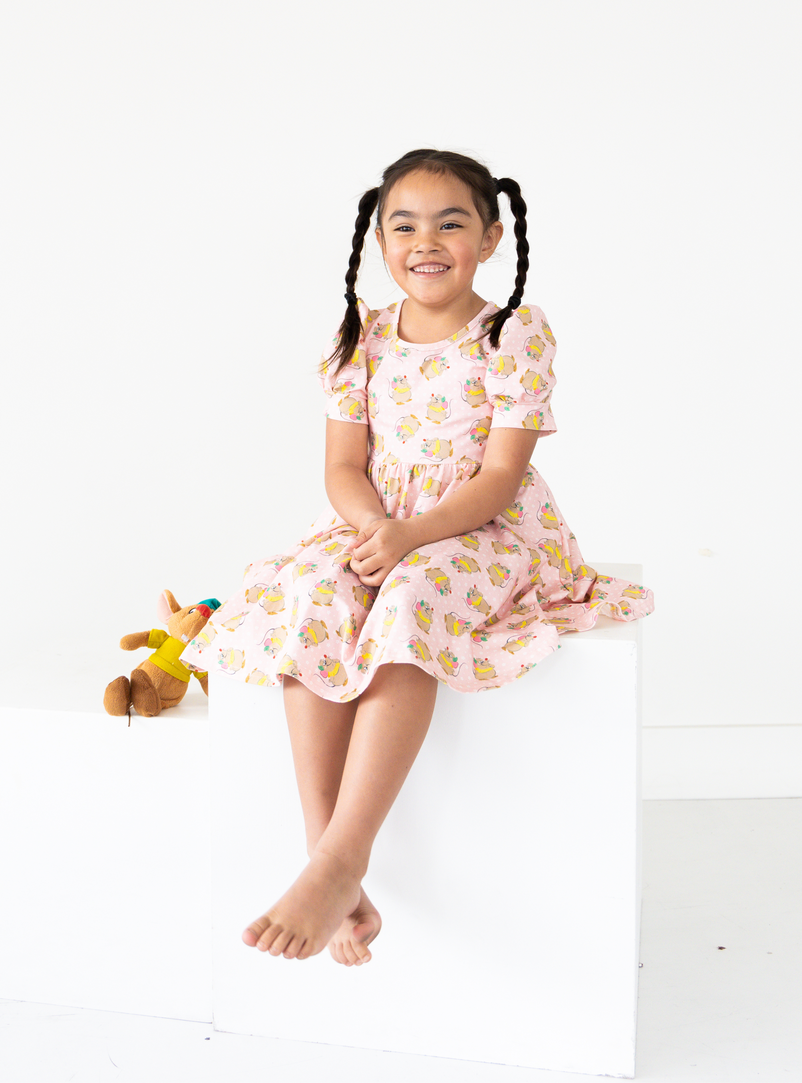 Disney and Taylor Joelle branded Gus Gus Dress with Gus Gus printed all around. This dress is detailed with puff sleeves.