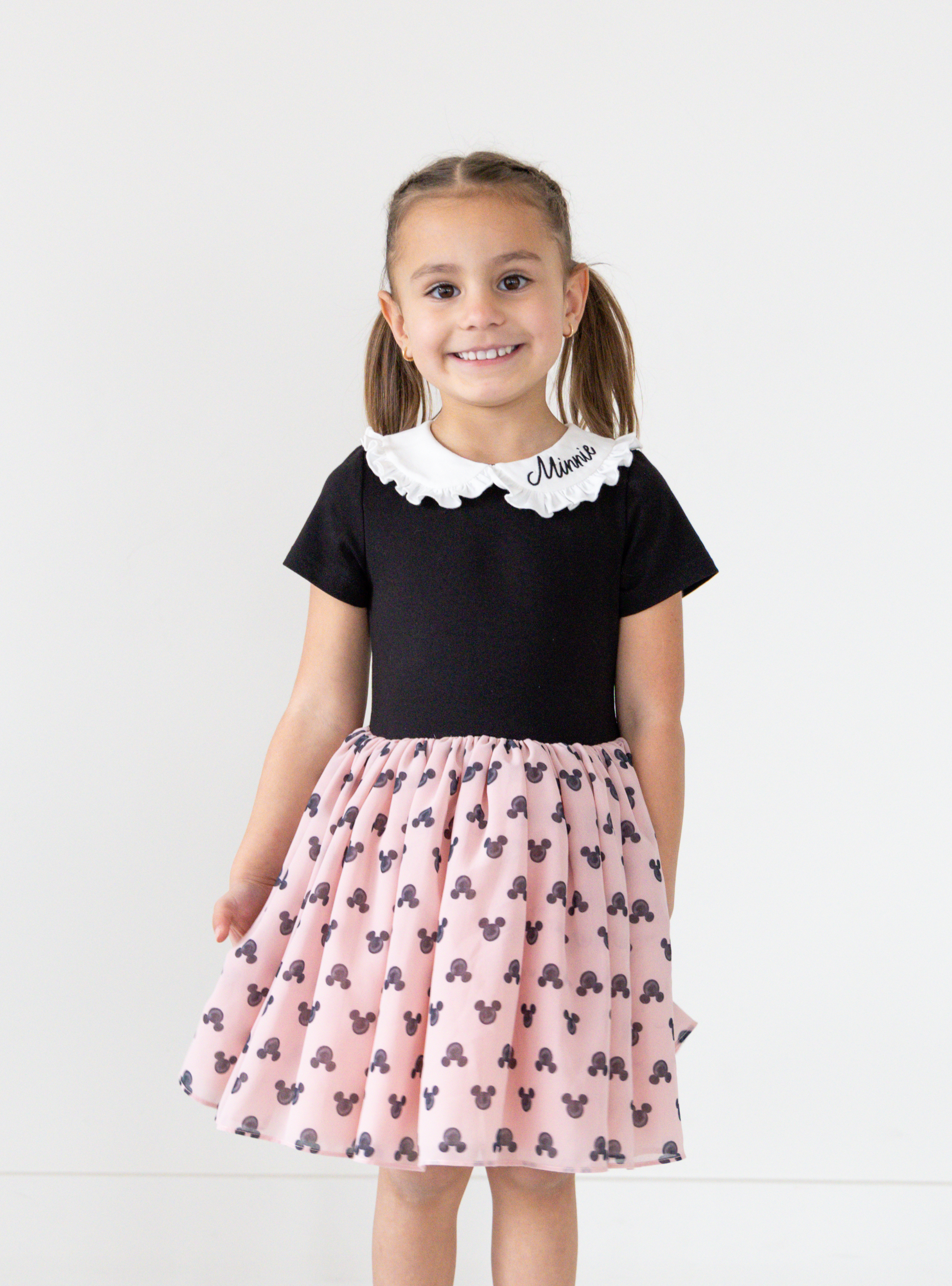 Disney and Taylor Joelle brand mickey mouse print on skirt of kids dress with ruffle and embroidered collar, short sleeves, and chiffon skirt