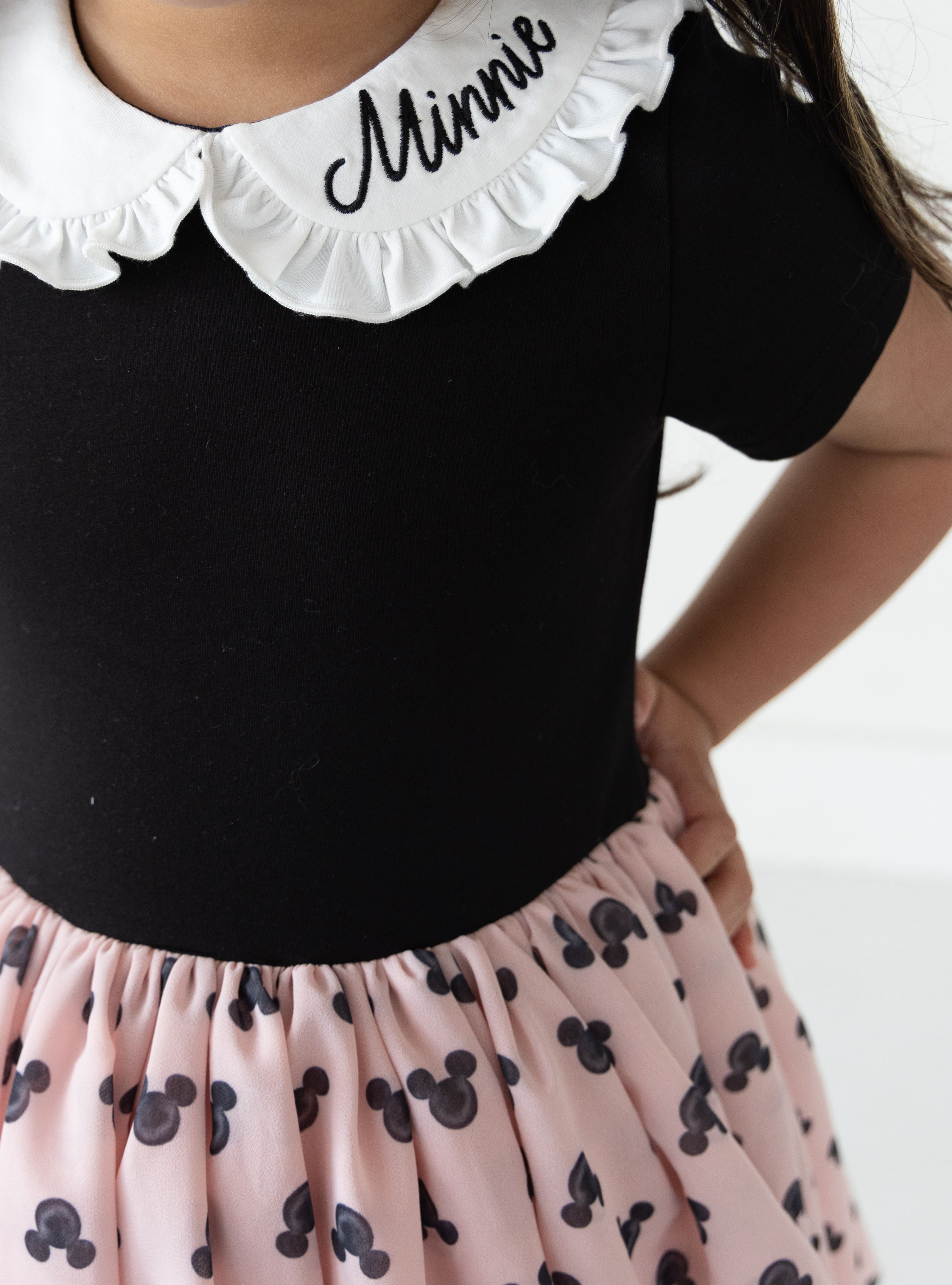 Disney and Taylor Joelle brand mickey mouse print on skirt of kids dress with ruffle and embroidered collar, short sleeves, and chiffon skirt
