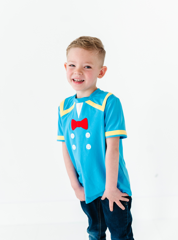 This Donald Duck-inspired Sailor Duck Tee is includes a playful design of bright colors, with a blue base and yellow and white details. And we can't forget the cute red bow!