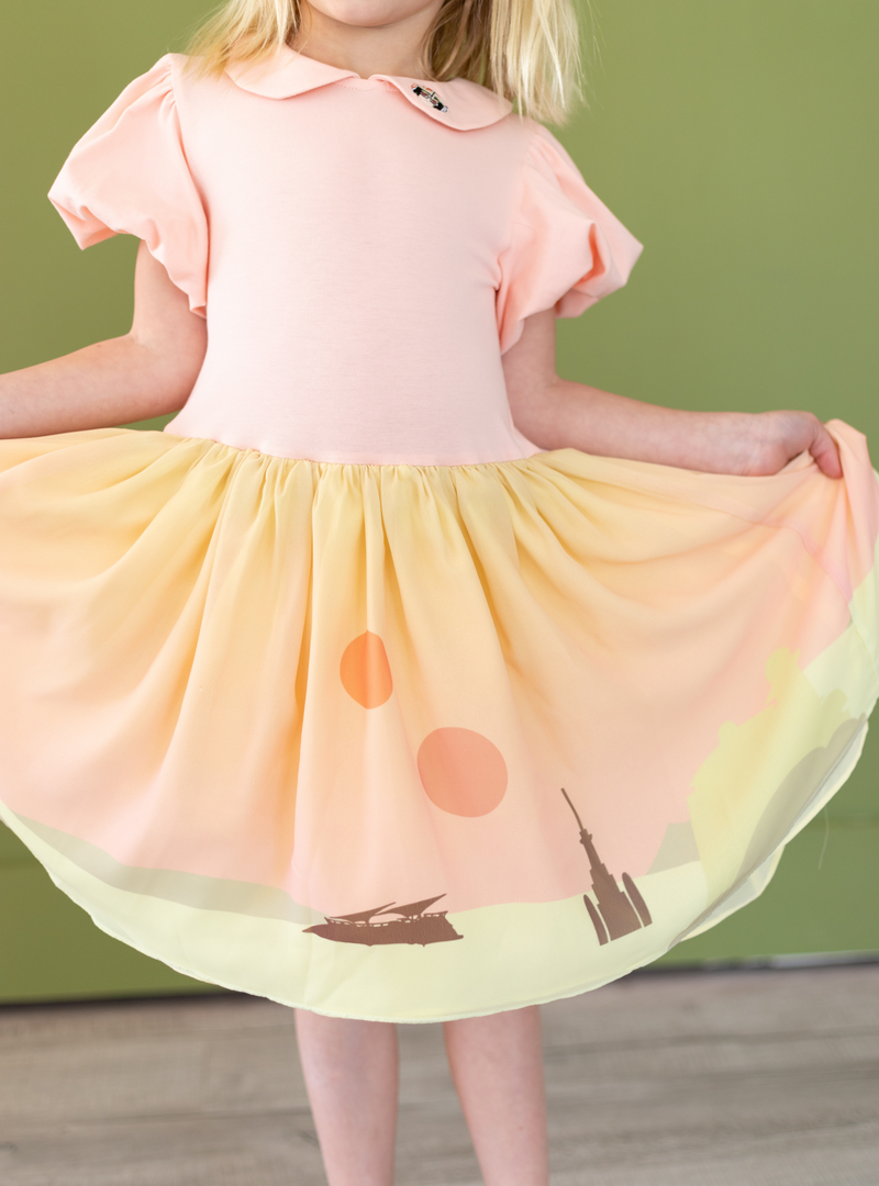 The Twin Sun Dress features a Tatooine-inspired sunset on the tutu skirt.