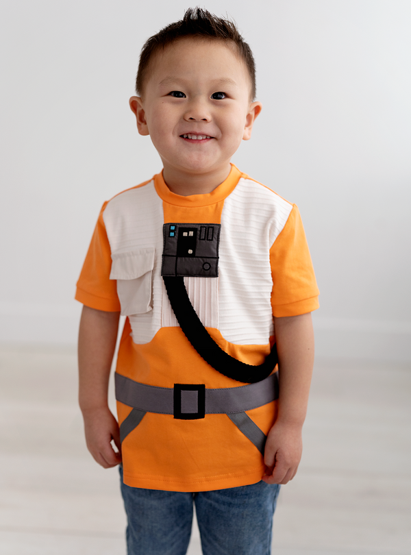 Made of cotton, this tee has many fun features and sewn-on designs, including a belt, strap and pocket.
