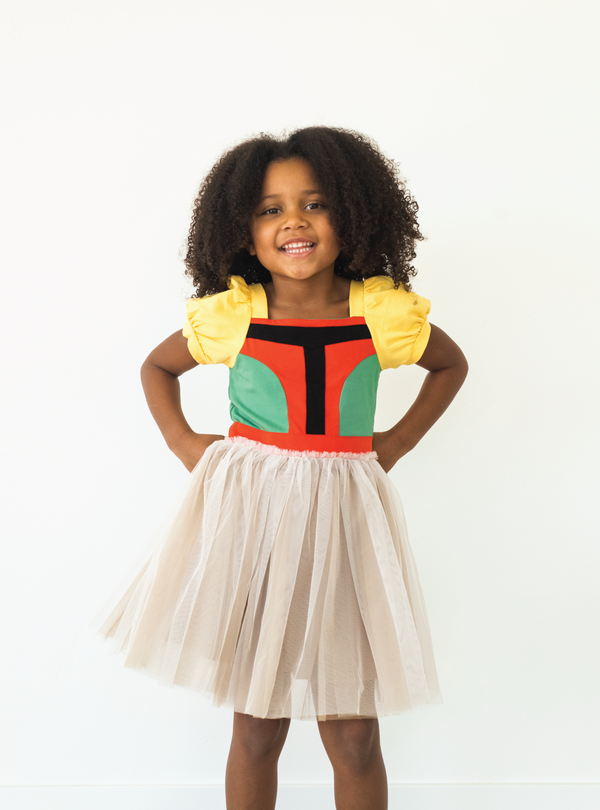 Another look at our Space Armor Dress. The bodice is cut and sew, with multiple fun colors such as green and orange.