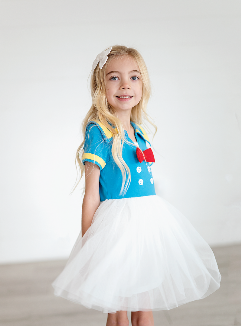 This Donald Duck-inspired dress is makes a perfect pair with our Sailor Duck Tee or our Darling Duck Dress!