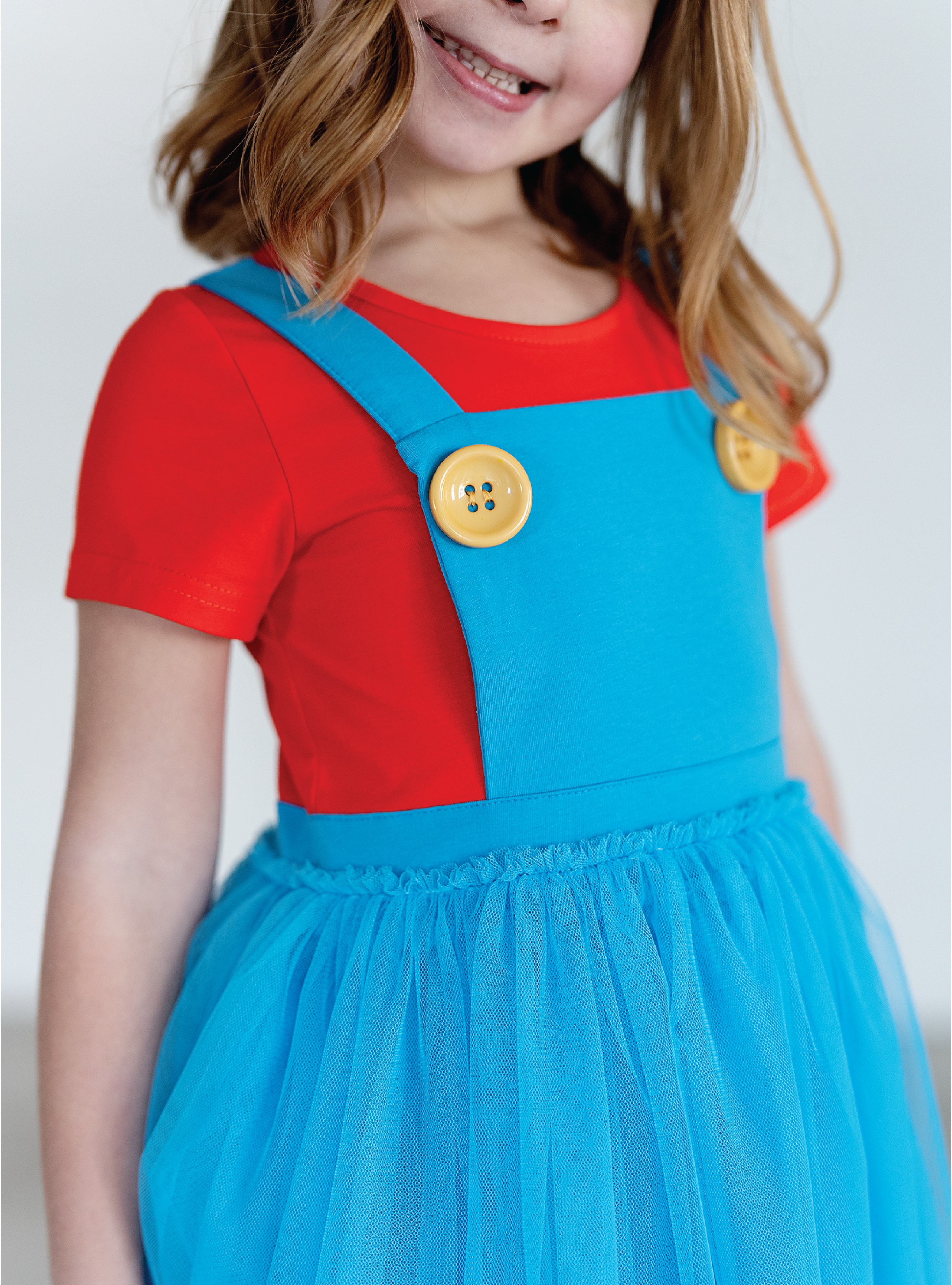 Accented with yellow buttons and twirly tulle!