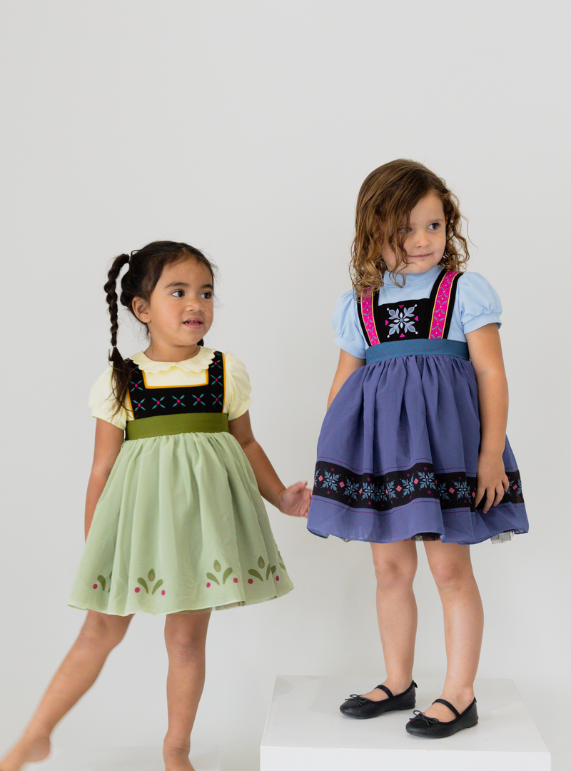 Two girls standing together showing the way these dresses match. 