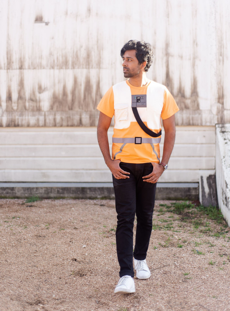 Another look at our Starfighter tee. A white ribbed fabric vest, grey belt, and black, ribbed, tube-inspired details add to the fun design of this tee.