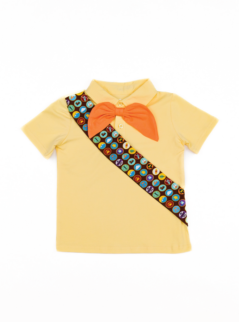 This tee features a pale yellow color, with an orange necktie and brown sash, along with a buttoned collar!