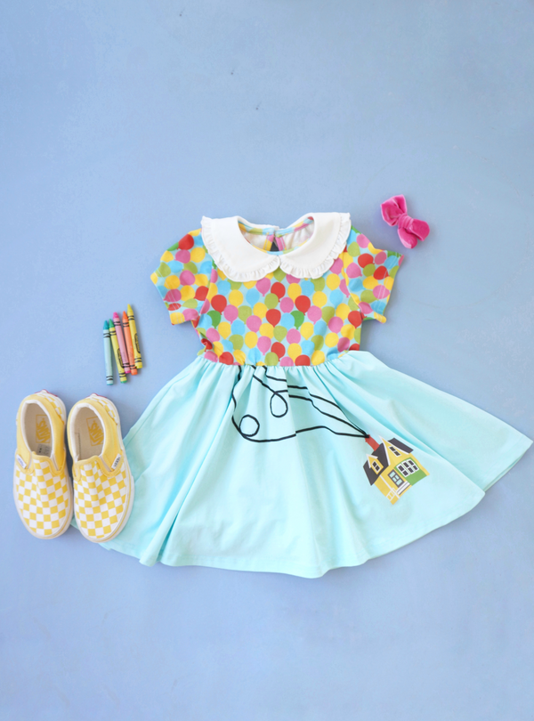 Here's a flatlay of our Balloon 2.0 Dress. There's so many fun ways to style this dress, such as with cute yellow street shoes and a velvet pink bow.