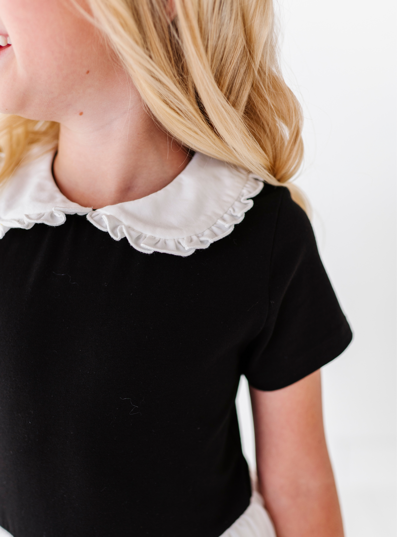 A close up on the cotton bodice and cute Peter Pan collar, with ruffles on the edge.