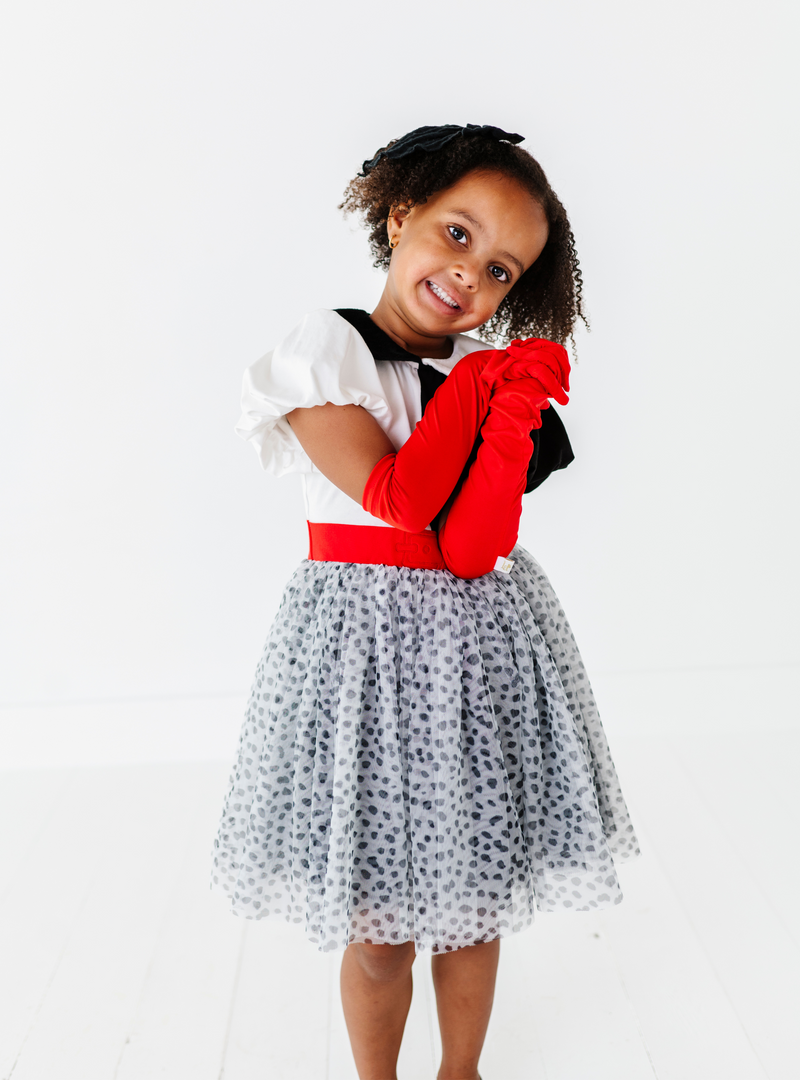 This dress features a red belt design and a cute black and white spotted skirt!
