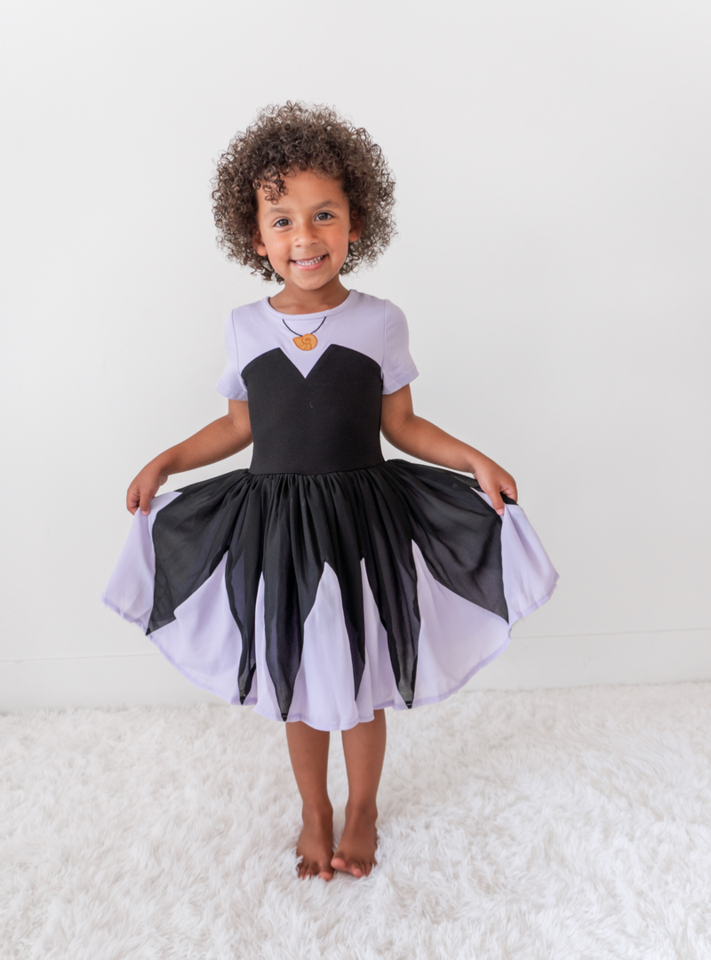 Featuring a chiffon skirt with tulle underlays. This skirt features a fun black and purple pattern!